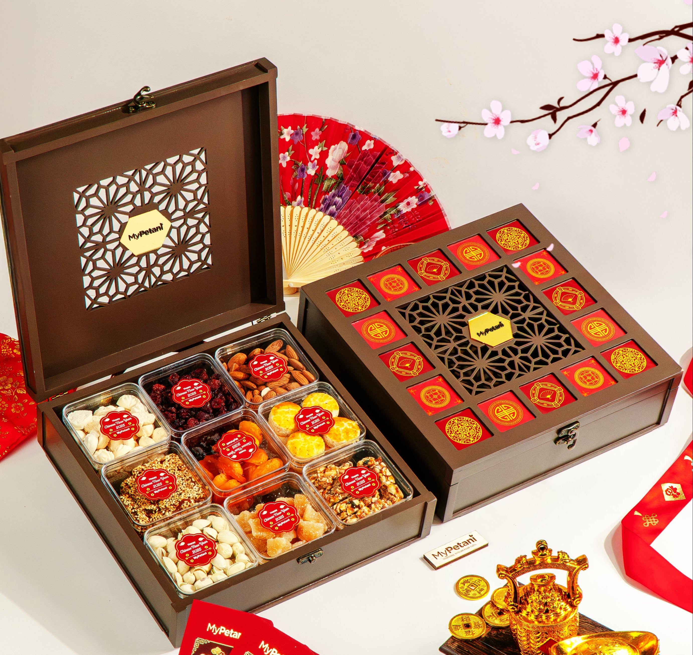 A wooden gift box with multiple compartments, each containing an assortment of freshly baked cookies and candies, displayed against a backdrop of Chinese New Year decorations including a red envelope, a golden crown, and traditional Chinese cookies.