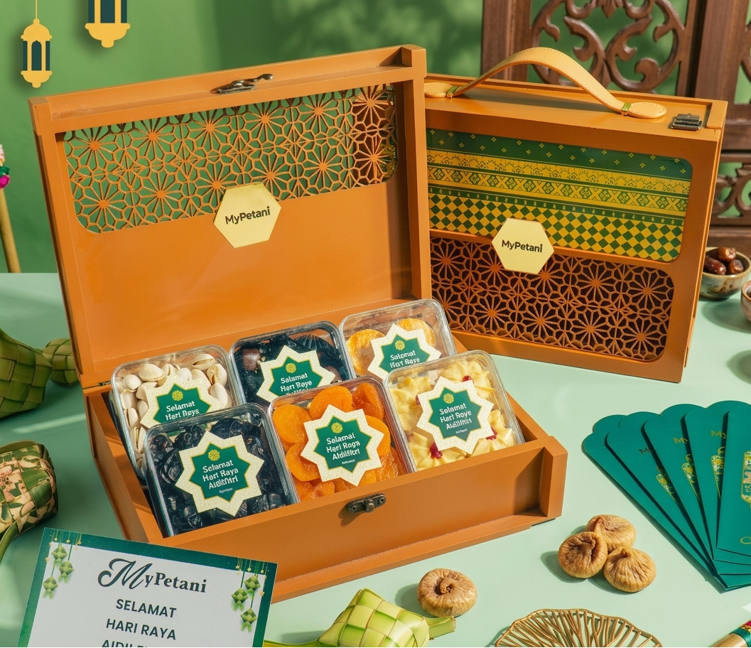 Decorative gift box with snacks and cards on a green table