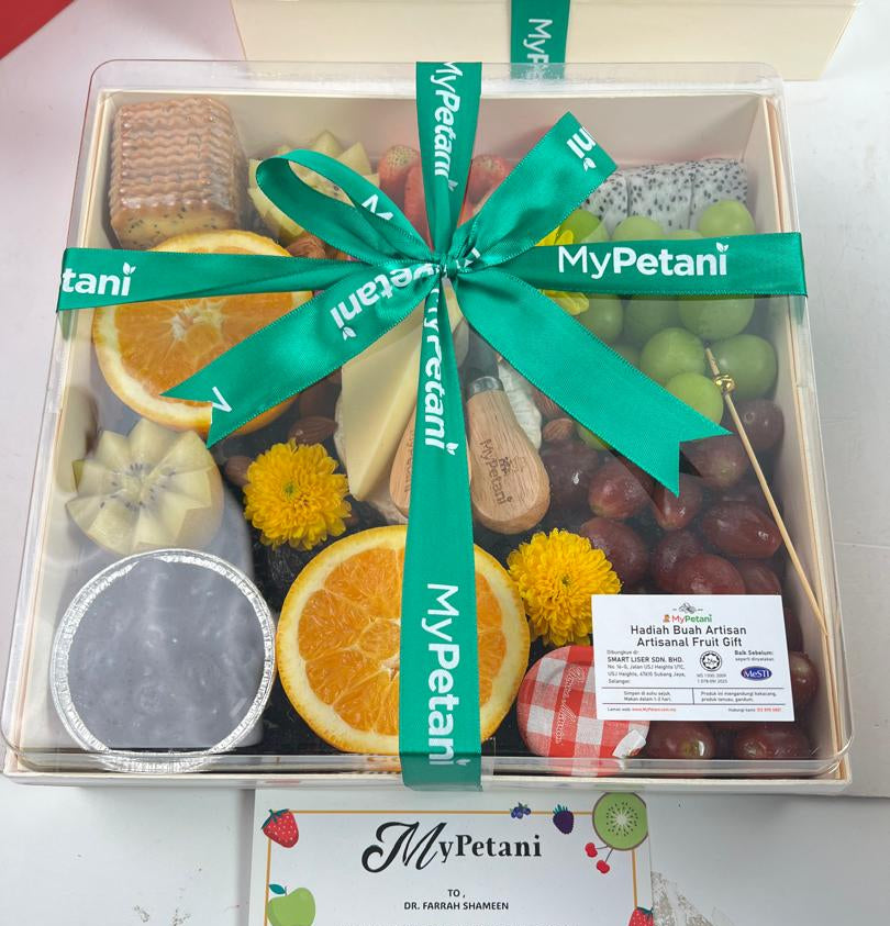 Fruit gift box with a green ribbon and 'MyPetani' branding on a white background.